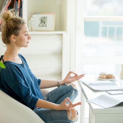 15 Yoga Desk Poses You Can Do From Your Chair